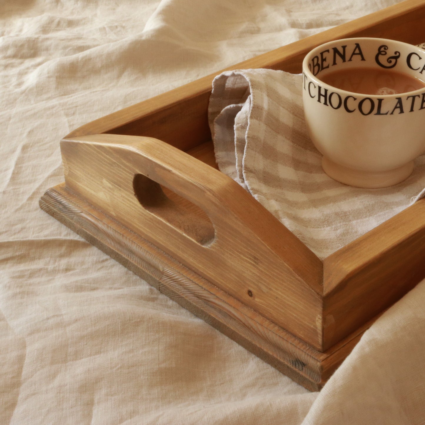 Manor handcrafted wooden tray styled on linen with a hot chocolate mug and gingham napkin — rustic home accessory by The Rustic Barn Company