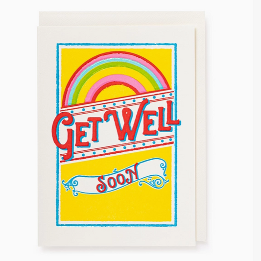 A greeting card with a bright yellow background, a colorful rainbow graphic, and the words 'GET WELL soon' in playful red, blue, and white lettering, shown with a white envelope behind it.