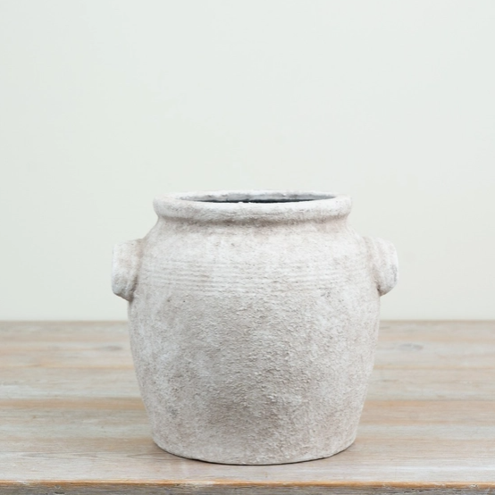 Soft cream vintage-style ceramic pot with a textured finish